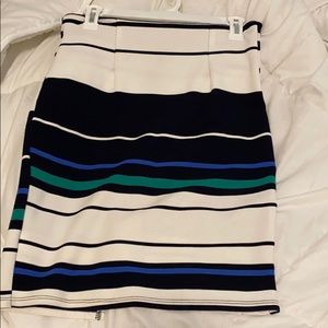 Black, white, blue, and green shirt